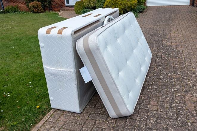 mattress being taken away by a professional removal service